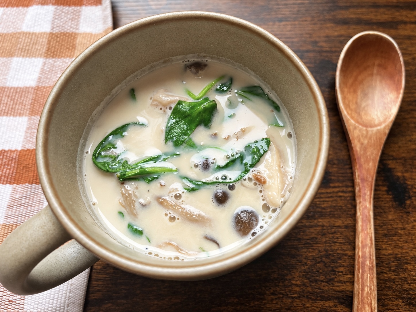 Creamy soy milk miso soup with mushrooms and fresh arugula