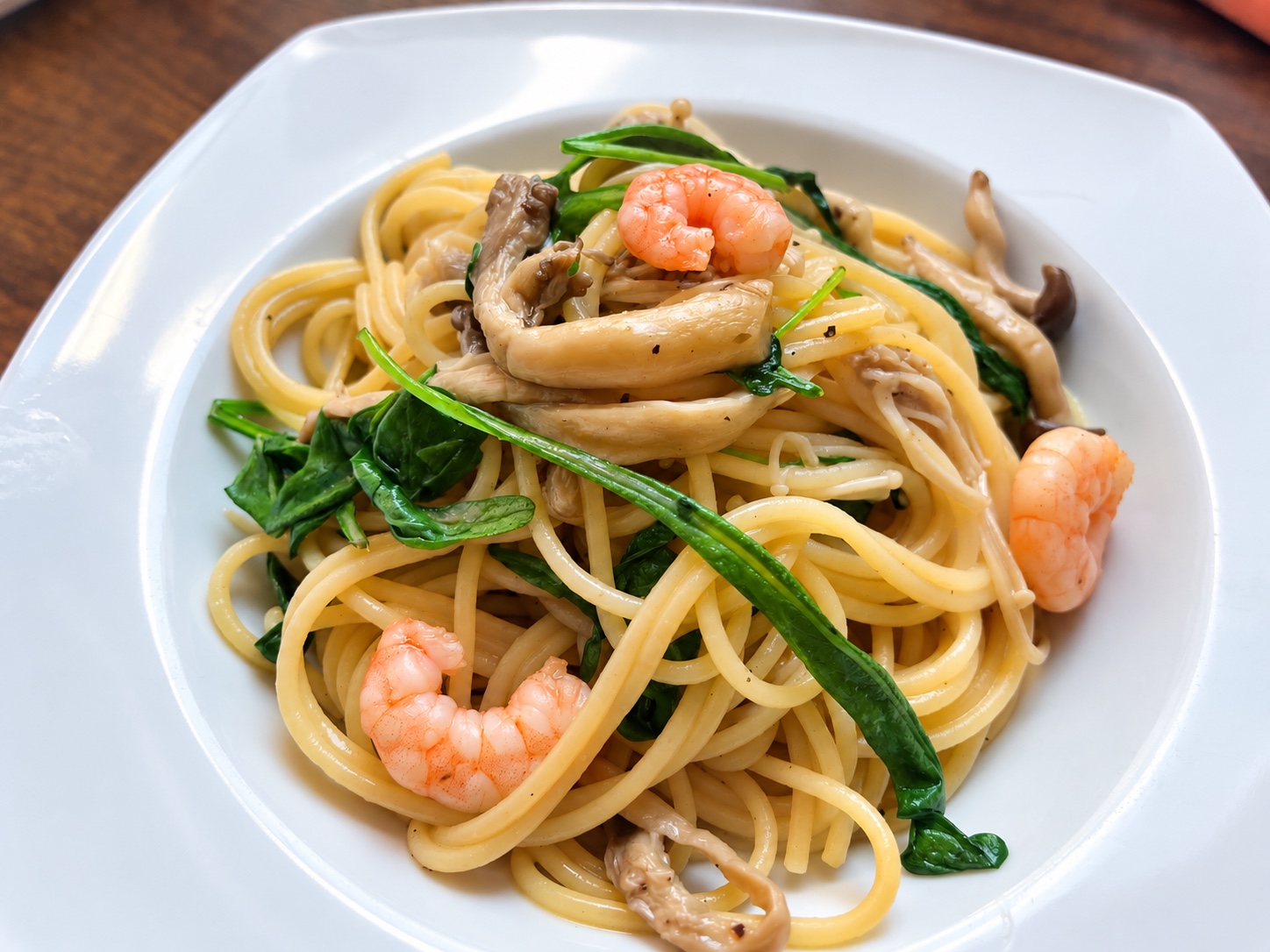 Japanese-style shrimp and mushroom pasta with arugula and dashi butter